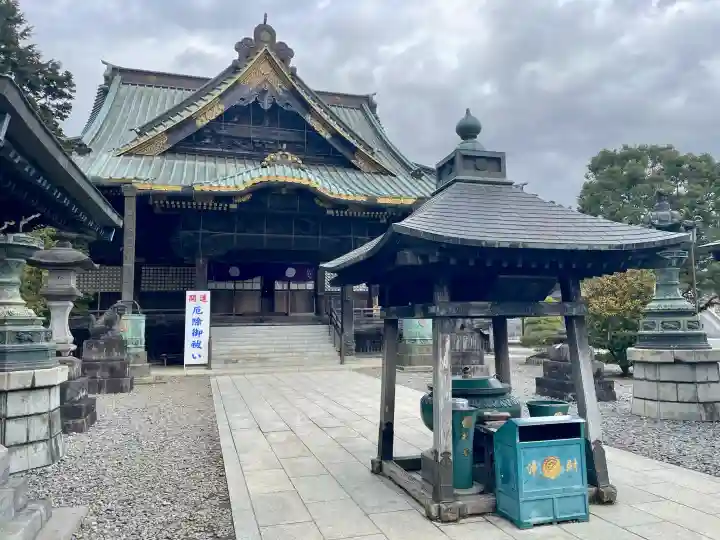 成田山釈迦堂の{uncategorized: "未分類", other: "その他", undefined: "問題あり", building: "その他建物", grave: "お墓", sacred_gate: "鳥居", guardian: "狛犬", statue: "像", buddha: "仏像", history: "歴史", nature: "自然", garden: "庭園", animal: "動物", pagoda: "塔", temizu: "手水舎", mountain_gate: "山門・神門", sanctuary: "本殿・本堂", subordinate: "末社・摂社", art: "芸術", scenery: "景色", jizo: "地蔵", ema: "絵馬", goshuin: "御朱印", omikuji: "おみくじ", items: "授与品その他", amulet: "お守り", goshuincho: "御朱印帳", eats: "食事", festival: "お祭り", votive_dance: "神楽", shichigosan: "七五三参", wedding: "結婚式", experience: "体験その他", initially: "初詣", around: "周辺", anti_infection: "感染症対策"}