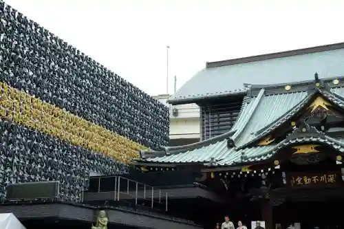 成田山深川不動堂（新勝寺東京別院）の{uncategorized: "未分類", other: "その他", undefined: "問題あり", building: "その他建物", grave: "お墓", sacred_gate: "鳥居", guardian: "狛犬", statue: "像", buddha: "仏像", history: "歴史", nature: "自然", garden: "庭園", animal: "動物", pagoda: "塔", temizu: "手水舎", mountain_gate: "山門・神門", sanctuary: "本殿・本堂", subordinate: "末社・摂社", art: "芸術", scenery: "景色", jizo: "地蔵", ema: "絵馬", goshuin: "御朱印", omikuji: "おみくじ", items: "授与品その他", amulet: "お守り", goshuincho: "御朱印帳", eats: "食事", festival: "お祭り", votive_dance: "神楽", shichigosan: "七五三参", wedding: "結婚式", experience: "体験その他", initially: "初詣", around: "周辺", anti_infection: "感染症対策"}