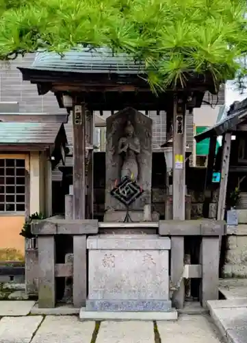 猫実庚申塔の像